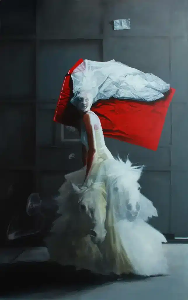 a woman in a white dress with a red and white pillow on her back